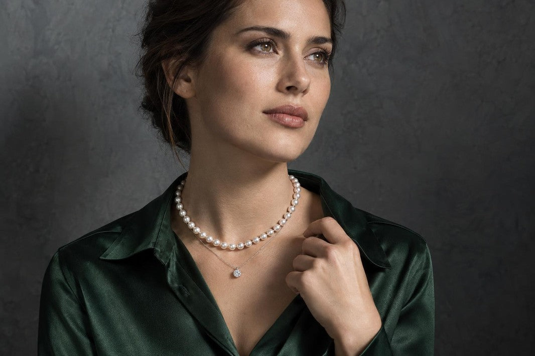 single model campaign shot, one woman alone in frame, three-quarter pose, shoulders-to-mid-chest crop