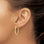 10K Polished and Textured Oval Hoop Earrings