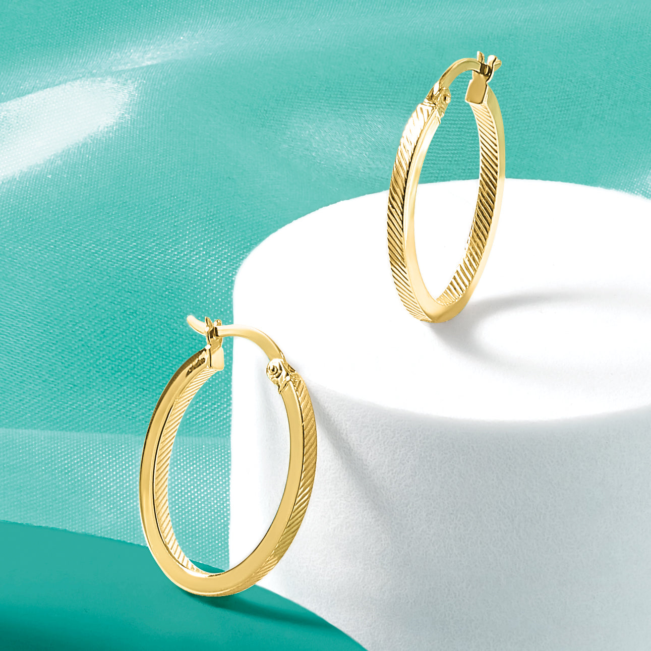 10K Polished and Textured Oval Hoop Earrings