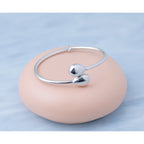 Sterling Silver RH-plated Teardrop accent Flexible Bypass Bangle