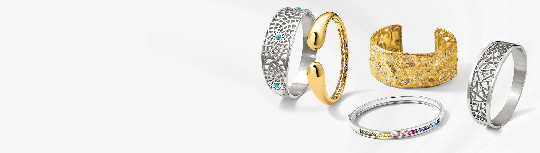 Bold bangle and cuff bracelets crafted from high-quality gold, silver, and stainless steel, featuring chunky designs and intricate patterns.