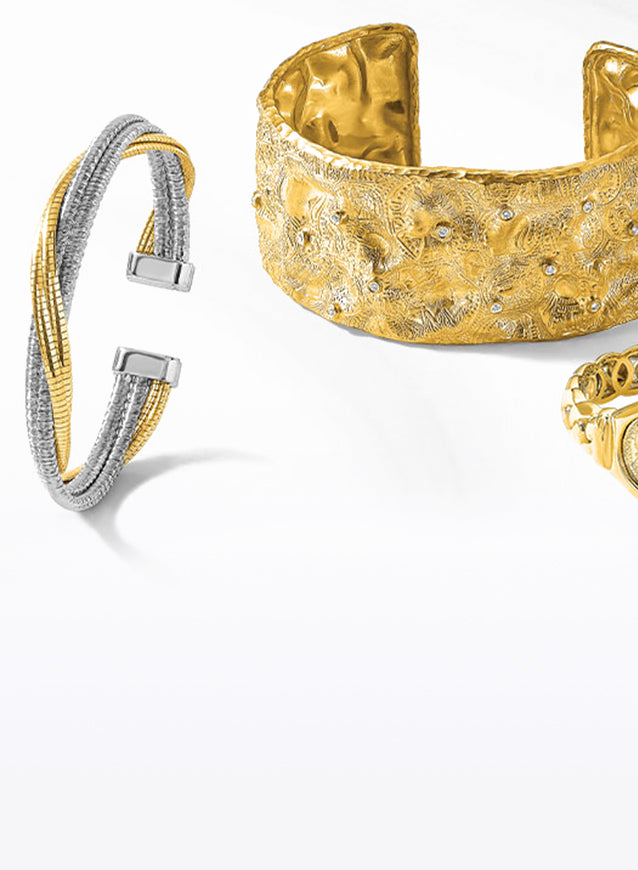 Bold bangle and cuff bracelets crafted from high-quality gold, silver, and stainless steel, featuring chunky designs and intricate patterns.