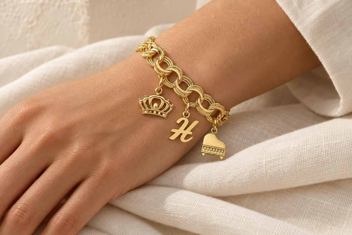 Triple link charm bracelet with crown, initial and piano charms in 14K yellow gold - Sophia Jewelers