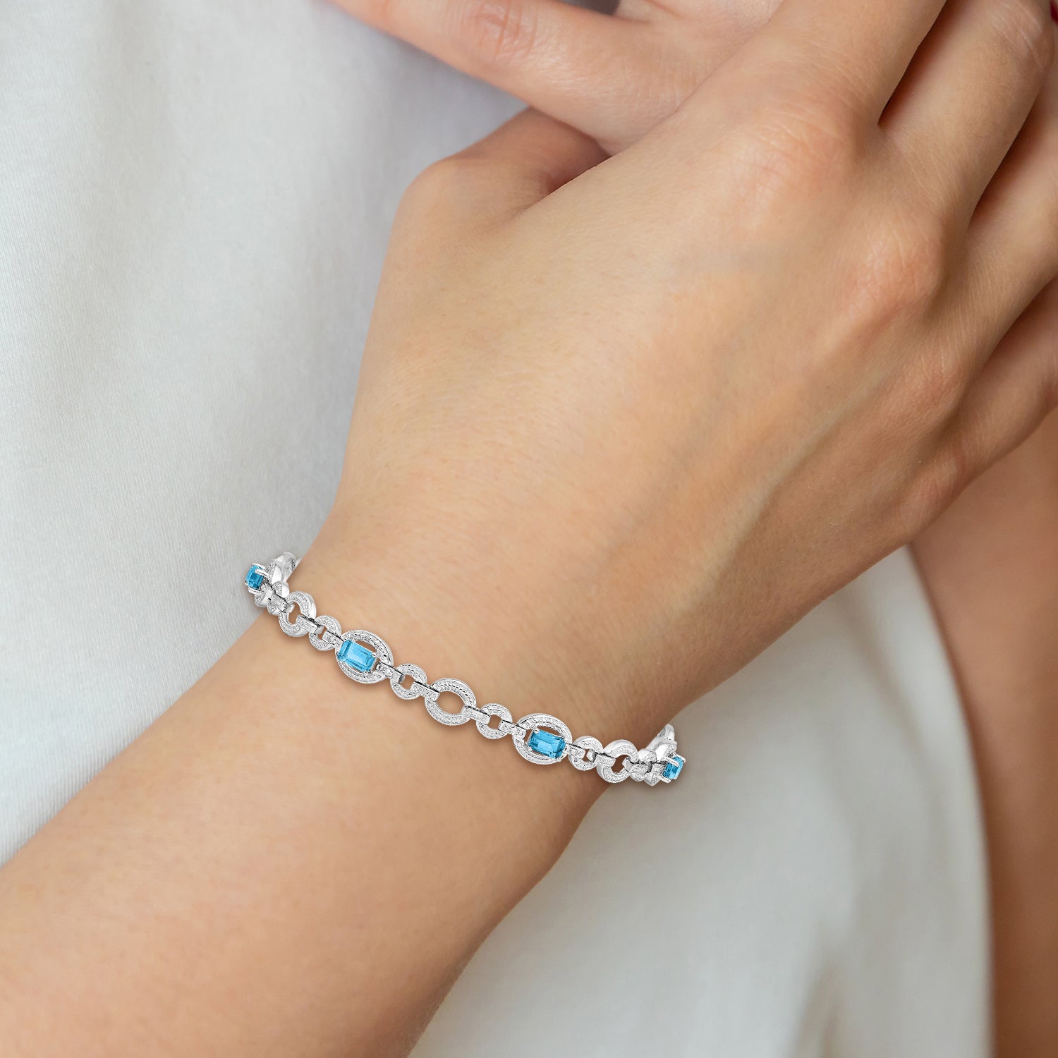 Sterling Silver Rhodium-plated Dia. & Lt Swiss Blue Topaz Oval Bracelet