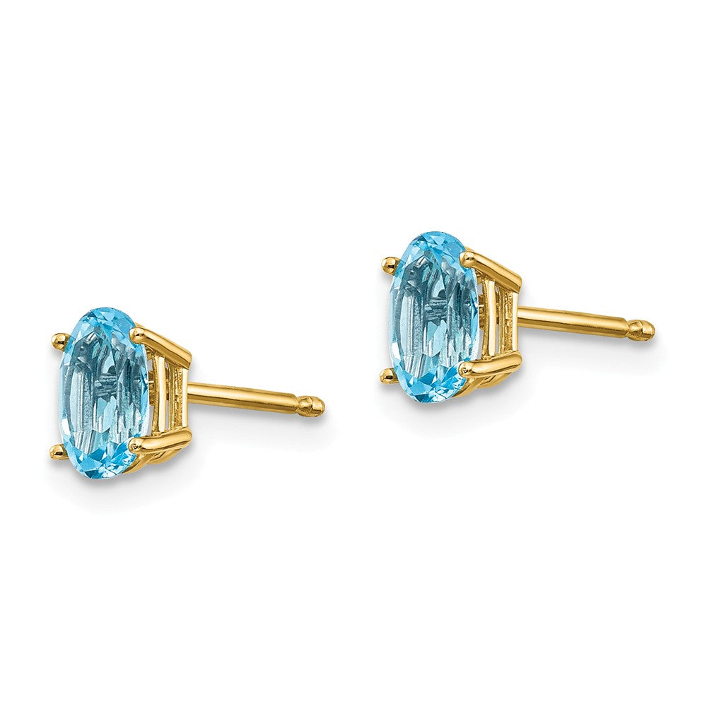 14K 6x4 Oval December/Blue Topaz Post Earrings Secondary image
